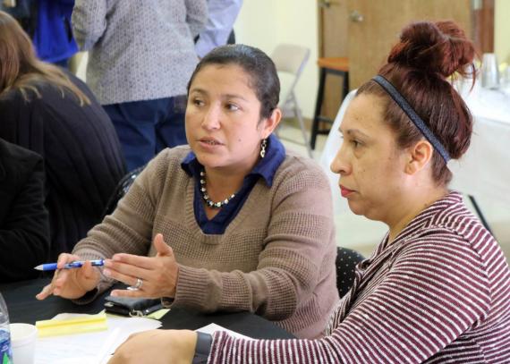 KU CCHD Community Mobilizer Monica Mendez engages in discussion with community stakeholders around community health priorities in a collaborative planning meeting in Wyandotte County.